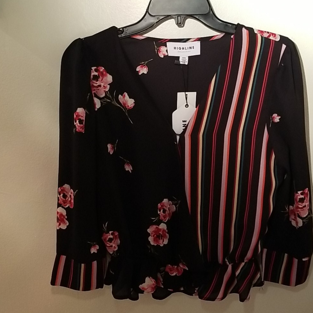 Highline wrap style blouse with bottom ruffle